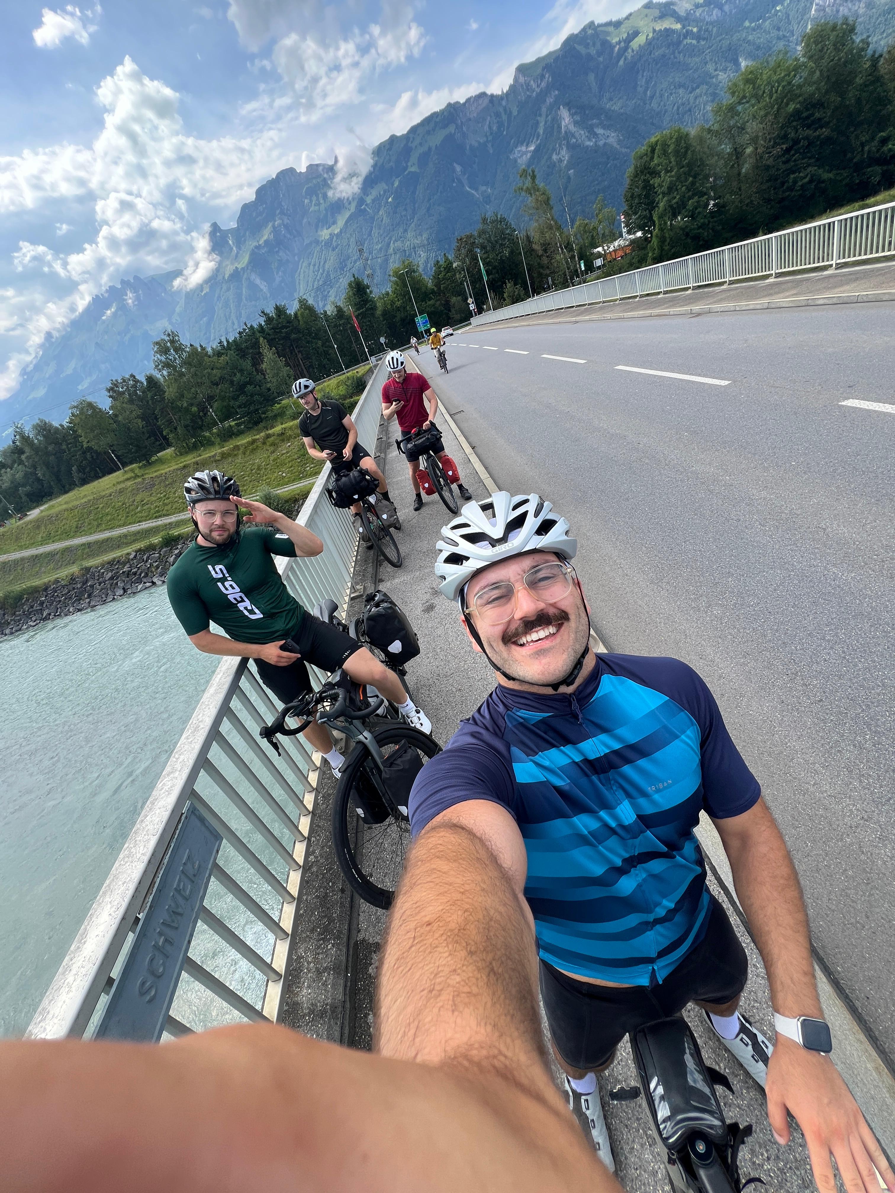 Group selfie on a bridge in the Alps